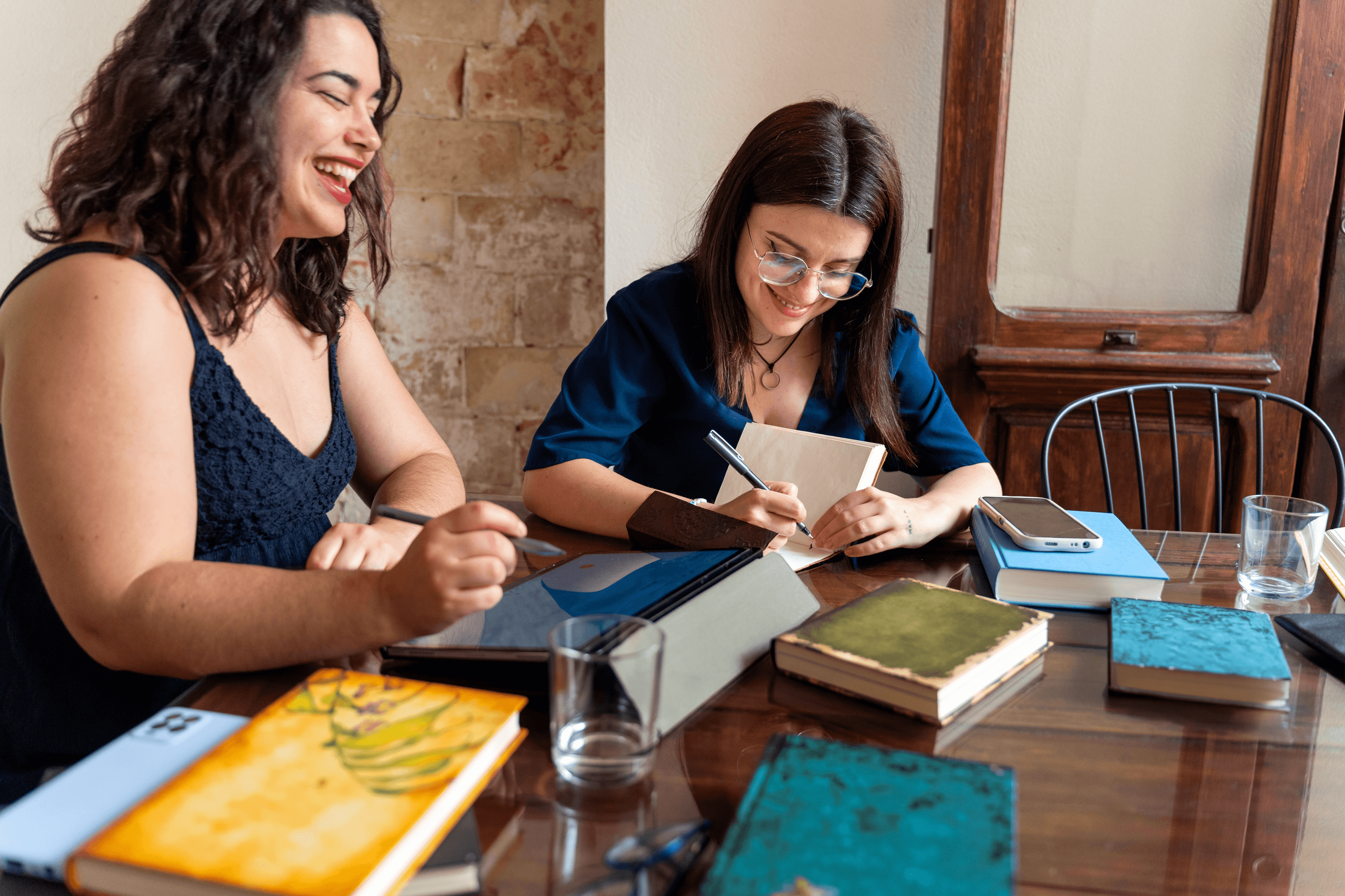 Two people on a table talking Two people on a table talking